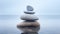 Stack of smooth pebbles in shallow water on the seaside, pebble cairn. Stone stack in a calm misty ocean. Generative AI