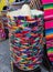 A stack of Sombreros in different colors for sale in a Mexico tourist shop