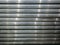 Stack of steel or metal profile sheets as abstract galvanized iron background for design