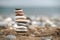 Stack of Stone over the sand. Balance and stability concept with stones.