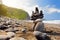 Stack of stones balanced on rocky beach of Pololu Valley, Big Island, Hawaii