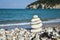 Stack of stones on the beach in summer.