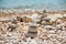 Stack of stones on the sea summer beach.The pile of the pebbles on the stony coast.Stones pyramid on pebble beach