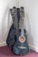 Stack of student classical acoustic guitars in music room