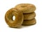 Stack of Three Bagels with One Leaning on the Side