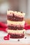 Stack of three irresistible red velvet mini cheesecakes