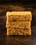 Stack of three pieces of golden syrup flapjack as background, healthy sweet snack