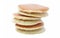 A stack of three plain pancakes on a white background.