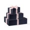 Stack of three realistic black gift boxes