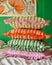 A stack of three striped pillows with curled edges, displayed on a shelf