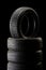 Stack of tires in dark ambient on black background