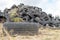 A stack of tires on an old garbage dump. Old worn out tires pile