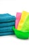 Stack of towels, bright napkins in the bowl