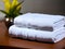 stack of towels with a pile of white towel on a wooden background, , Ai Generated