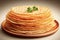 Stack of traditional Russian pancakes on a beige plate. Homemade Russian thin pancakes or pancakes