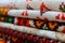 Stack of traditional Ukrainian folk art knitted embroidery patterns on textile fabric