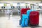 Stack of travelers luggage in airport terminal