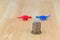 Stack of US coins, American money with blurred red blue dinosaur