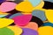 A stack of various color guitar picks