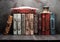 Stack vintage books on a wooden shelf,.inkwell and feather.