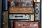 Stack of vintage leather suitcases background