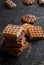 Stack of waffles on a black table, cookies background