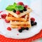 Stack waffles with ripe summer berry