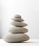 Stack of white balanced zen spa stones isolated. white background. 3d illustraton