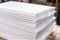 a stack of white shipping envelopes with bubble wrap inside