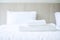 Stack of white towel and Bathrobe on bed in luxury hotel or resort. Laundry, Relax, holiday, spa, massage and vacation concepts