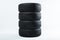 Stack of winter tires with specific structure and deep ridges shot in studio