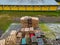 Stack of wooden pallets aerial view. Outdoor pallet storage area under the roof next to the chicken farm. Piles of Euro-type cargo