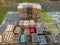 Stack of wooden pallets aerial view. Outdoor pallet storage area under the roof next to the chicken farm. Piles of Euro-type cargo