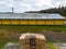 Stack of wooden pallets aerial view. Outdoor pallet storage area under the roof next to the chicken farm. Piles of Euro-type cargo