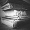 Stack of worn antique books. Black and White.