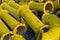 Stack of yellow steel pipe