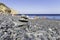 Stack of zen spa stones on Mavra Volia volcano gravel beach