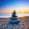 Stack of zen stones on pebble beach at