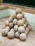 Stacked ancient Canon balls made of granite rock