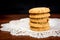 Stacked apple chip cookies on white napkin