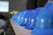 Stacked blue safety helmets on the shelf in the office, stock photo