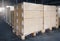 Stacked of cardboard boxes wrapped plastic on pallet rack. Interior of storage warehouse. shipping warehouse logistics.