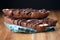Stacked Chocolate Biscotti on Wood with Black Background Closeup