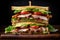 Stacked club sandwich with layers of grilled chicken, crispy bacon, avocado, lettuce, and tomato on a wooden board