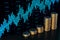 Stacked coins with growing blue forex chart on dark wallpaper. Stock market and trade concept. 3D Rendering