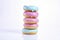 Stacked Colorful Donuts on White