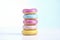 Stacked Colorful Donuts on White
