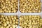 Stacked crates of fresh harvested potatoes in market for sale in Ile de RÃ© France for background