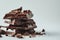 Stacked Dark Chocolate Pieces with Rich Cocoa Powder GenerativeAI