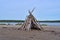 Stacked driftwood on the beach of Sears Island in Maine